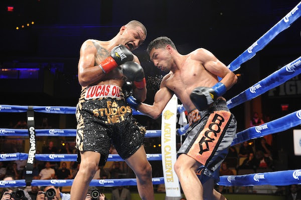 osesito Lopez, right, works the body against Aron Martinez