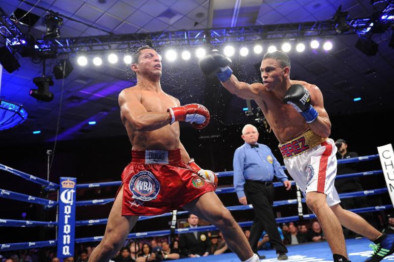 Lightweight Darley Perez, right, successfully defended his WBA Interim Title Friday, Jan. 9 on ESPN2
